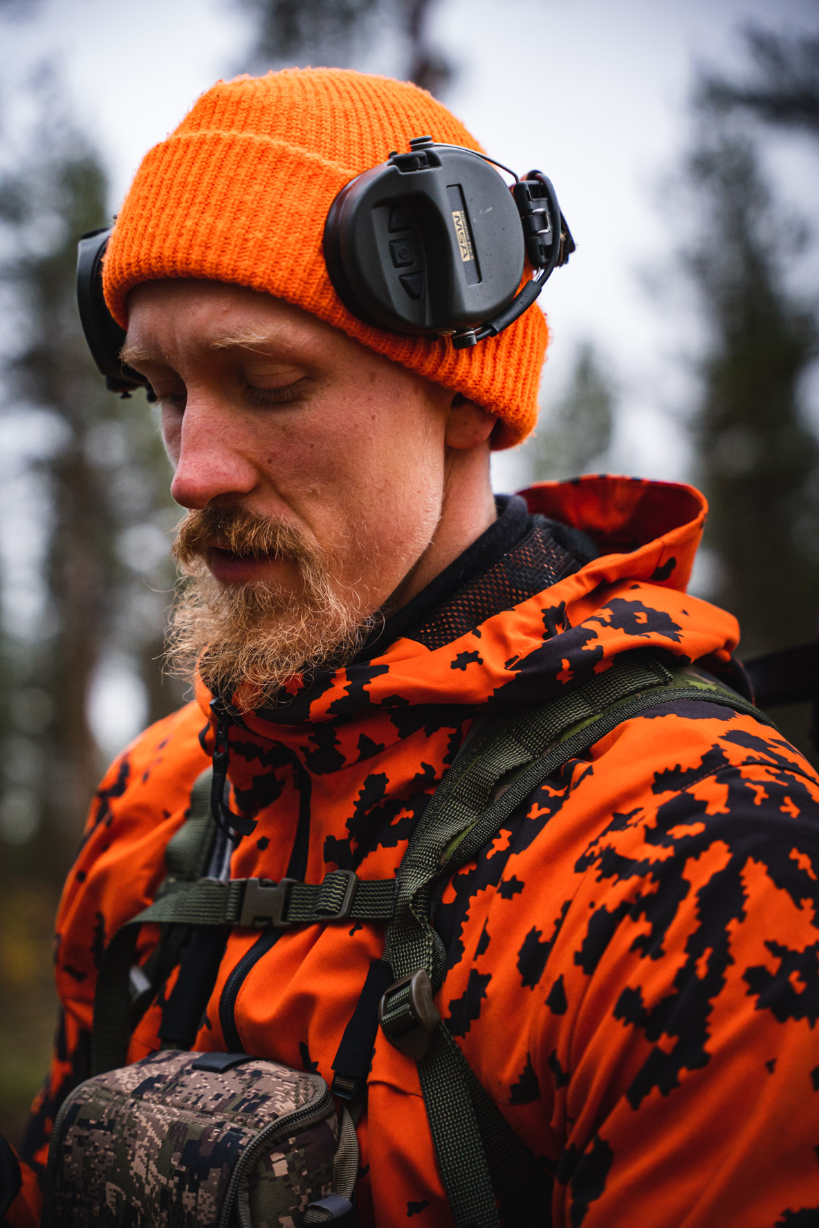 A moose hunter with active hearing protection