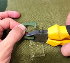 Removing the old slide buckles: two snips with side cutters.
