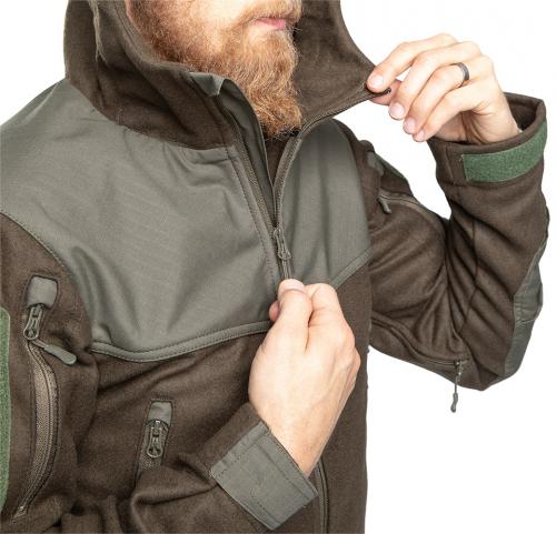 Särmä TST Woolshell-takki. Vetoketjun takapuolella tuulisuojalista. Kuvassa vihreä-ruskea (poistunut väri).